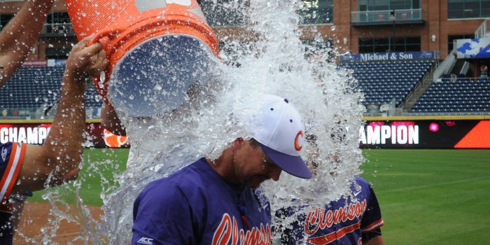 Lee gets doused by his players Sunday 