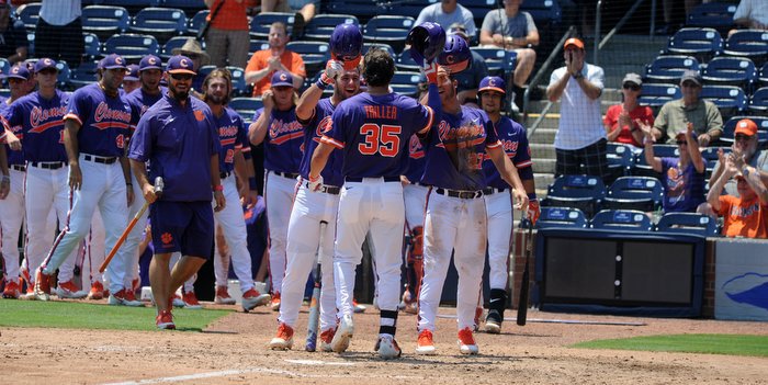 Triller celebrates with his teammates after his homer 