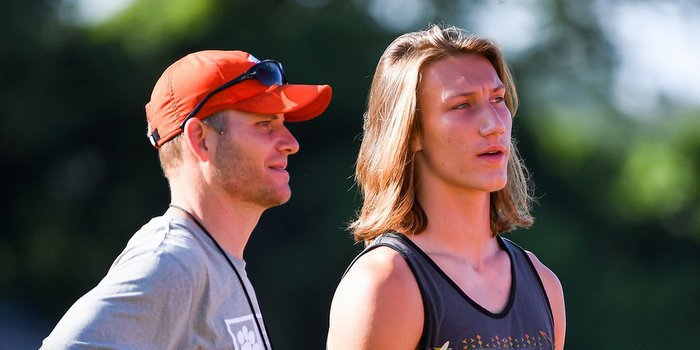Lawrence and QB's coach Brandon Streeter at Swinney's camp in June