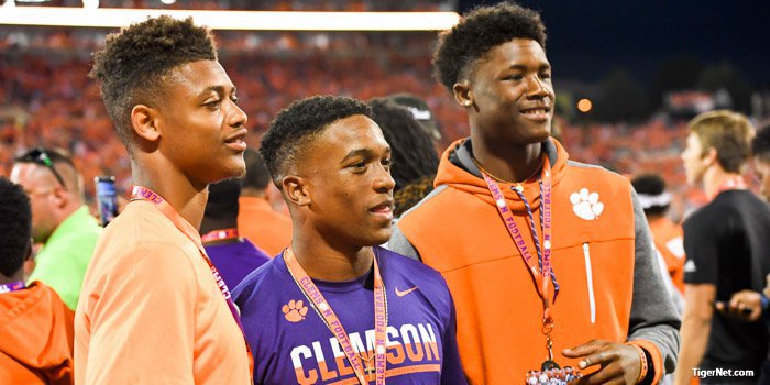 A.J. Terrell (L), Amari Rodgers and Tee Higgins on the sidelines before the game 