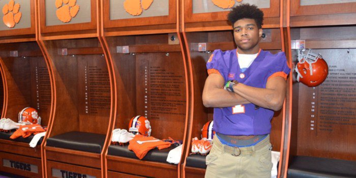 Williams poses in the Clemson locker room earlier this year 