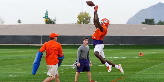 Cain goes high for the football during practice in Arizona last December 