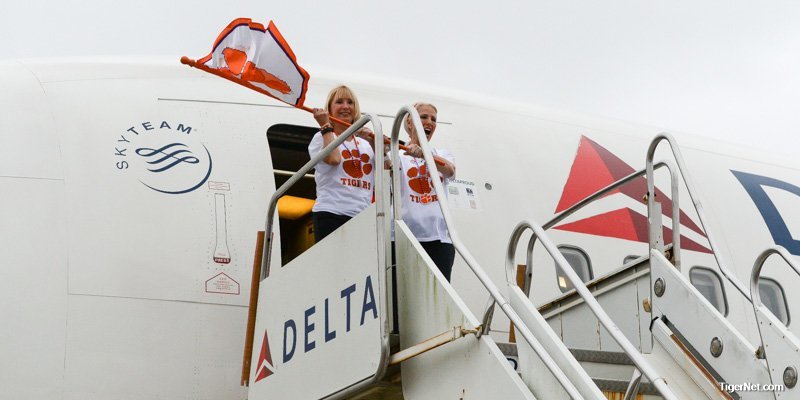 Clemson head coach Dabo Swinney and his wife Kathleen walk off the plane in New Orleans