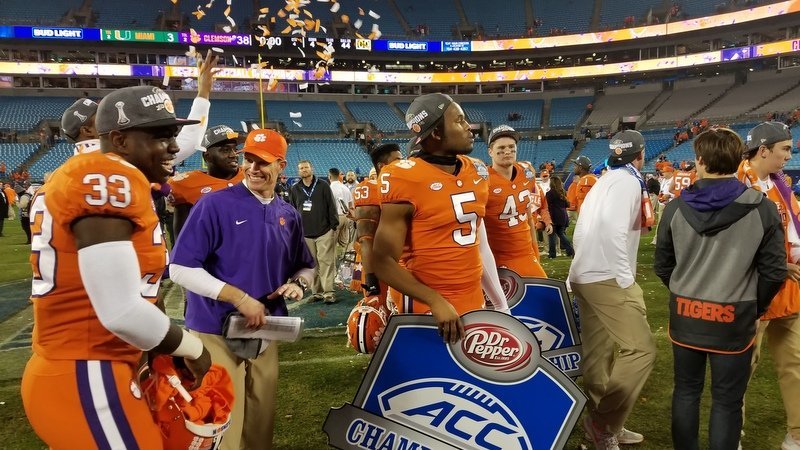 Brent Venables with confetti and his linebackers 