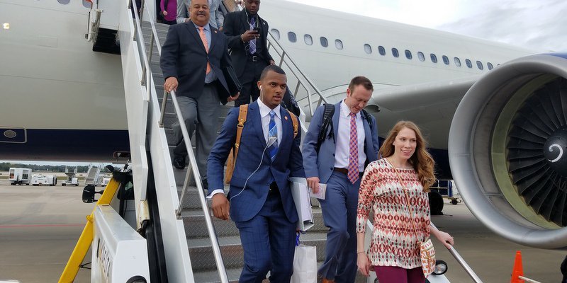 Watson walks off the plane in Tampa Friday afternoon