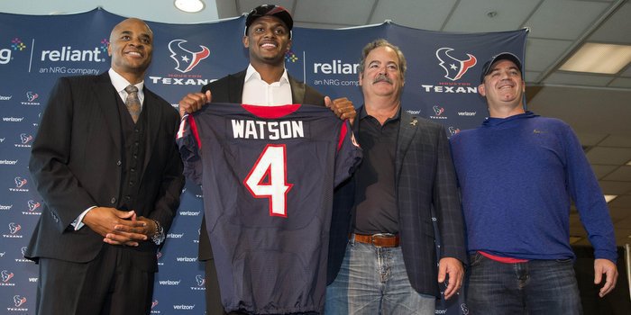 Watson posed with Texans execs last week in Houston (Photo by Troy Taormina USAT)