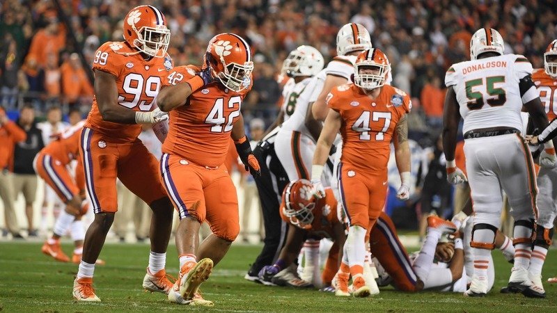 Christian Wilkins gestures to the crowd Saturday night 