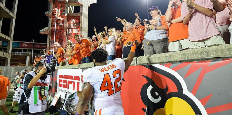 Christian Wilkins celebrates with the crowd after the win