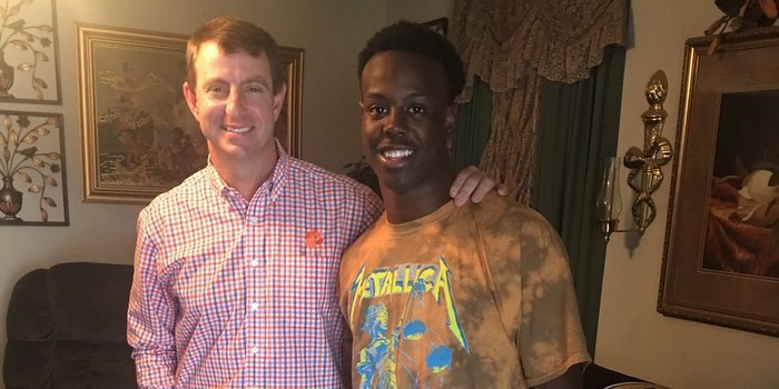 Etienne poses with head coach Dabo Swinney earlier this year 