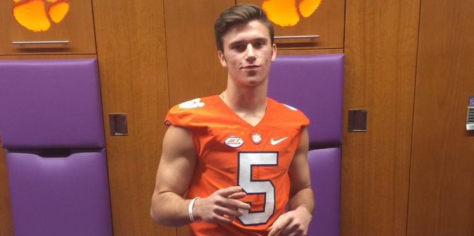 Groulx poses in the Clemson locker room during his visit 