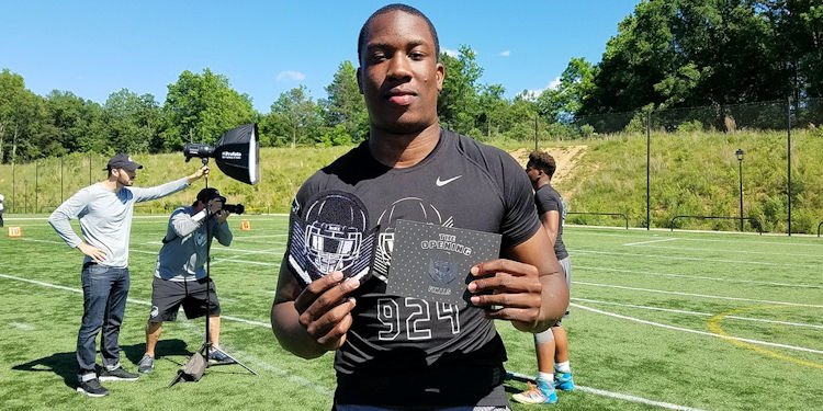 K.J. Henry shows off his Opening invite 