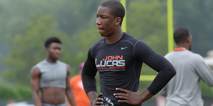 Henry works out at Dabo Swinney's camp last summer 