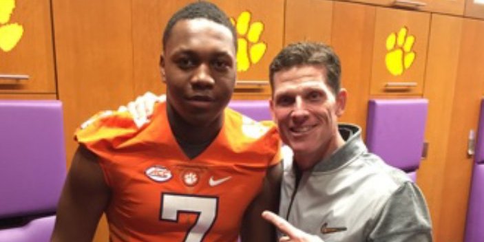 Mascoll poses with Brent Venables two weeks ago 