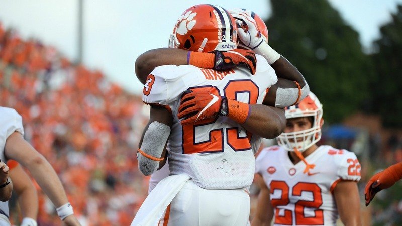 Christian Wilkins celebrates with Lyn-J Dixon late 