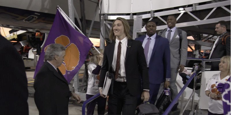 Clemson QB Trevor Lawrence and the Tigers arrive for the Goodyear Cotton Bowl. 