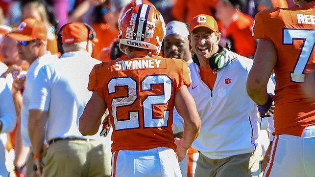 Will Swinney is greeted by his dad after scoring his first career touchdown 