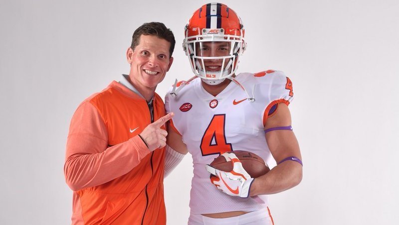 Maguire poses with defensive coordinator Brent Venables 