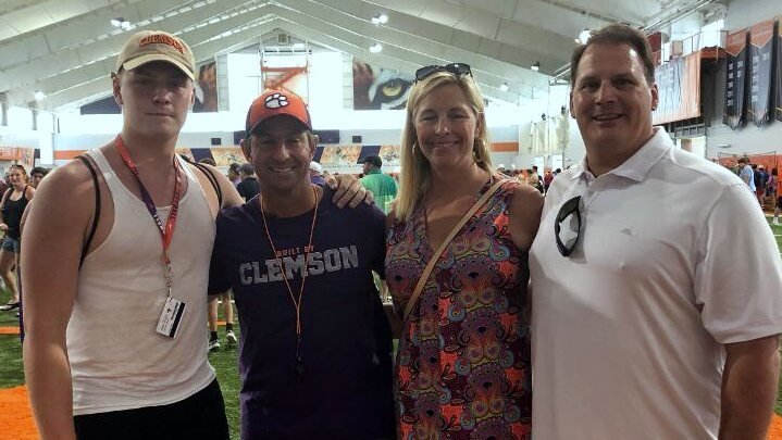 Parks and his family pose with Clemson head coach Dabo Swinney 