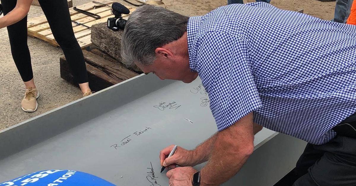 Athletic Director Dan Radakovich signs the last beam on Clemson's softball stadium