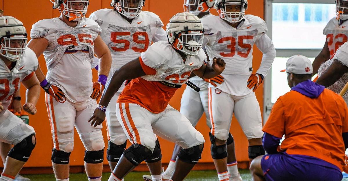 members of the defensive line work with Da'Quan Bowers