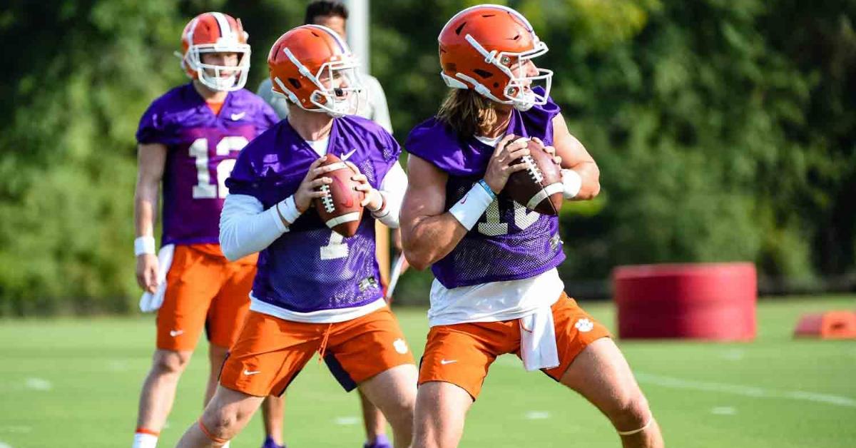 Trevor Lawrence and Chase Brice throw during an earlier practice