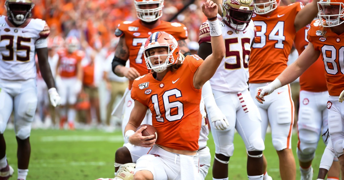 Trevor Lawrence raises his arms in celebration after his touchdown run 