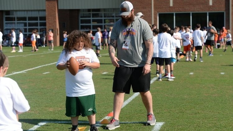 Sean Pollard gives instruction to a young camper