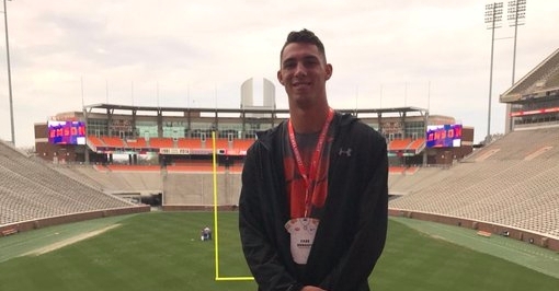 Cade Denhoff poses on top of the hill at Clemson