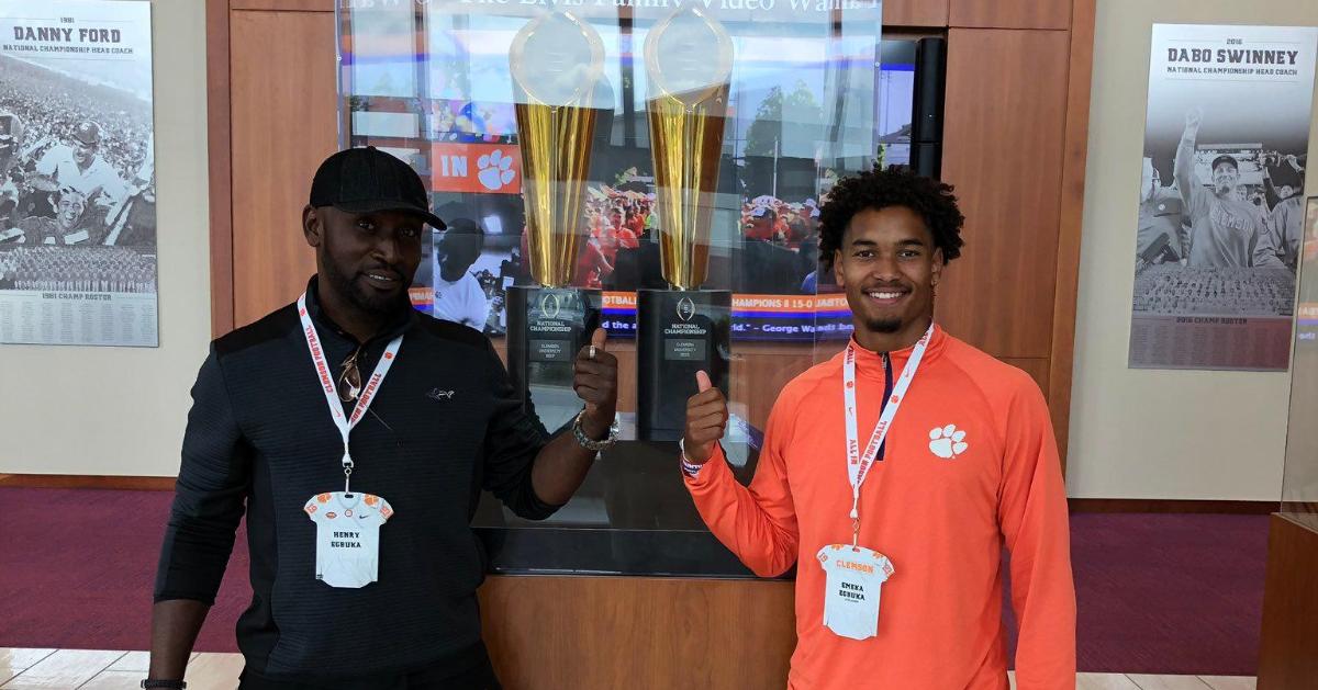 Egbuka poses with the National Championship trophies on his visit 