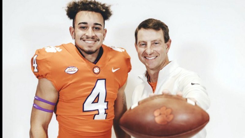 Fleming poses with head coach Dabo Swinney during his visit 