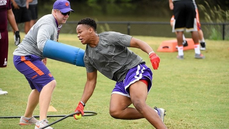 Smalls works out with assistant Zach Fulmer at Clemson's camp last summer 
