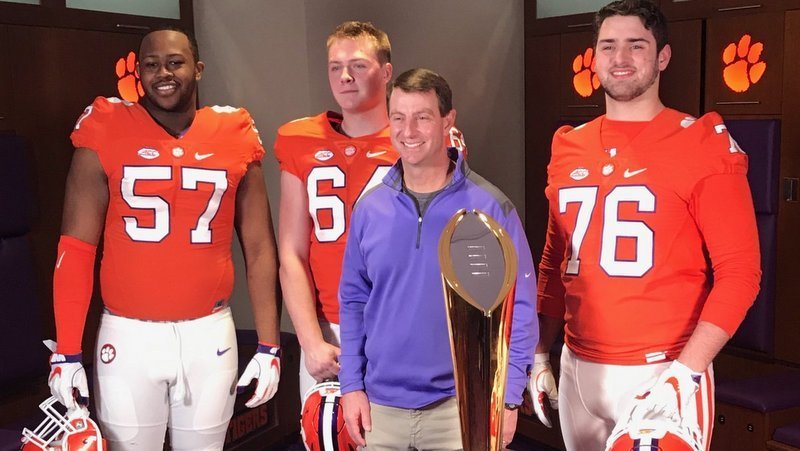 Swinney poses with so me of the 2020 signees.