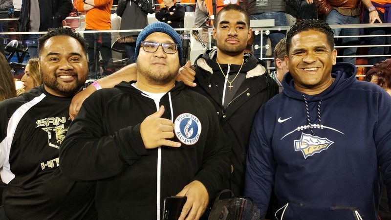 Uiagalelei, his coaches and father at Monday's national championship game