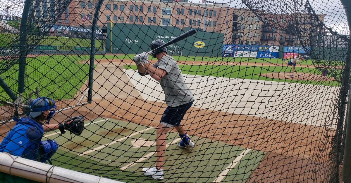 Logan Davidson takes his cuts Monday at Fluor Field in Greenville.