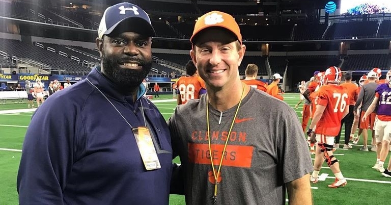 Smith poses with head coach Dabo Swinney during practice for the Cotton Bowl.