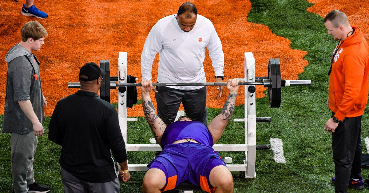 Larry Greenlee (top) and Adam Smotherman (right) watch Gage Cervenka at Pro Day. 