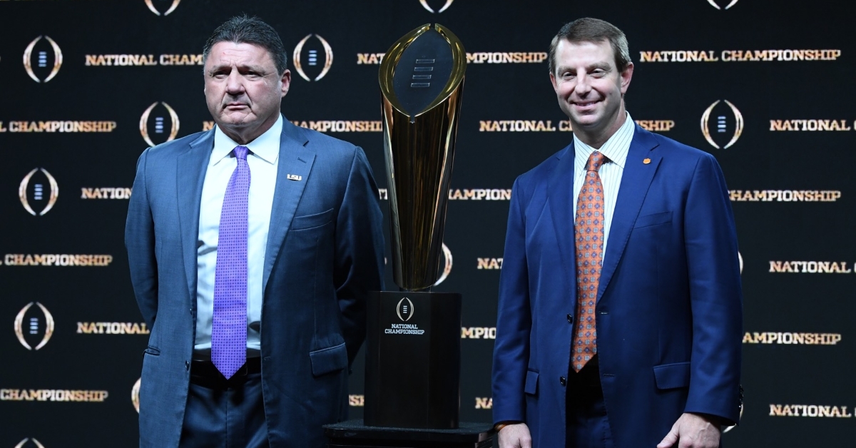 Orgeron and Swinney pose with the National Championship trophy Sunday