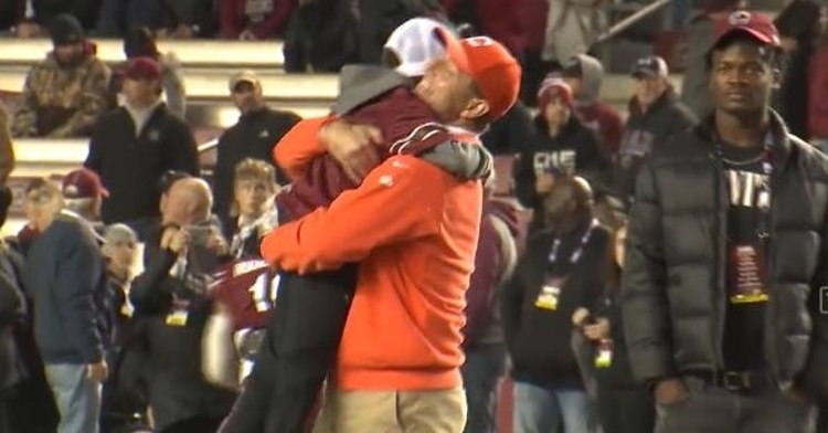 Swinney and Hunter share a hug during pregame