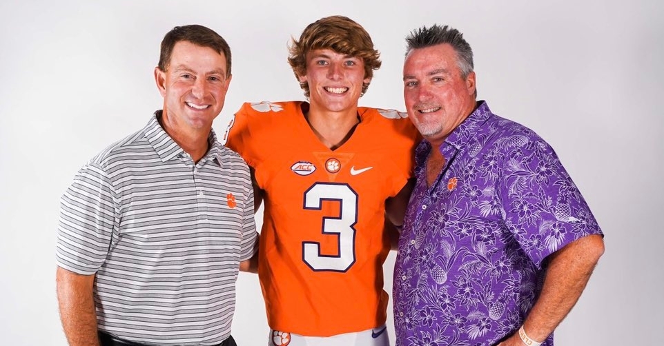 Gunn poses with his father (right) and head coach Dabo Swinney (left).