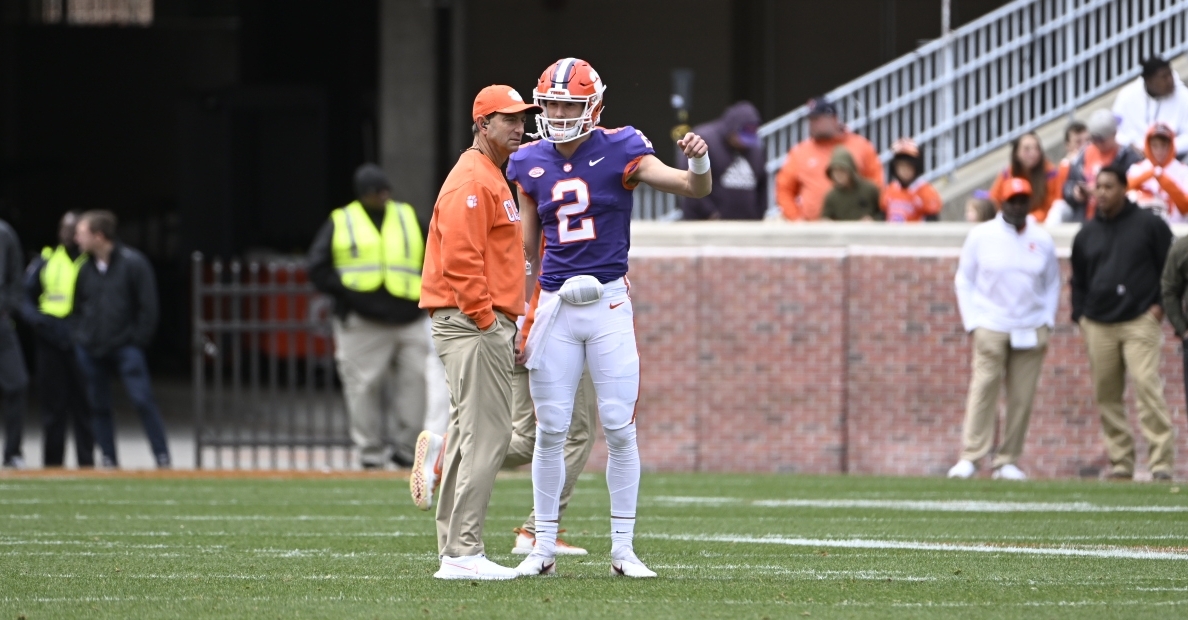 Klubnik and Swinney discuss a play during the spring game.