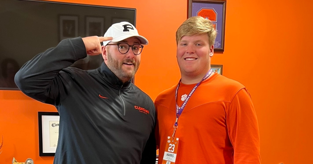 Sewell (right) poses with offensive line coach Thomas Austin.